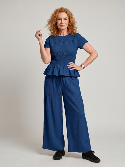 Eirenne | Conjunto de top fruncido con detalle de peplum y pantalones de pierna ancha